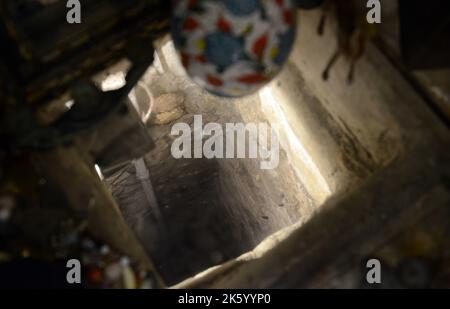 An ancient water well located in a souvenir shop on David St in the old city of Jerusalem. Stock Photo