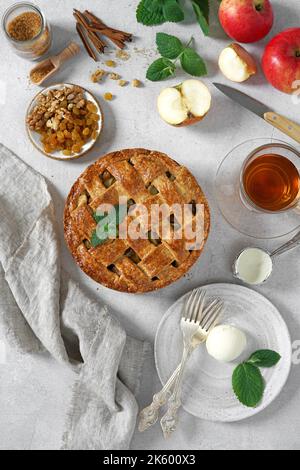 Homemade Dutch apple pie and ingredients on a light table and icecream. top view Stock Photo