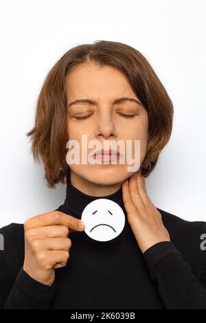 Sore throat in a woman. Angina. Thyroid disease. Stock Photo