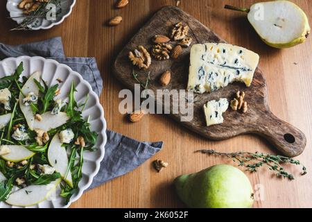 Healthy salad with pears, arugula, walnut and blue cheese. Stock Photo