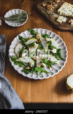 Healthy salad with pears, arugula, walnut and blue cheese. Stock Photo