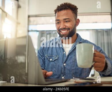 Freelance businessman drinking coffee at home. Young entrepreneur enjoying a cup of tea before work. Coffee and work go well together. Businessman Stock Photo