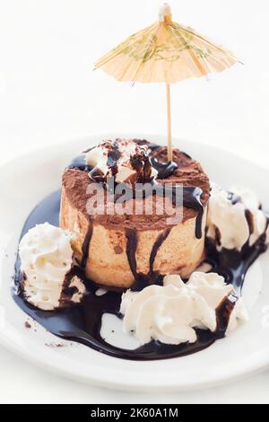 Tiramisu ice cream cake with cream and party decorations (shallow dof) Stock Photo