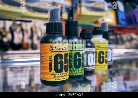 Dunlop guitar care products in a music store. Dunlop Manufacturing, Inc. is a manufacturer of musical accessories Stock Photo
