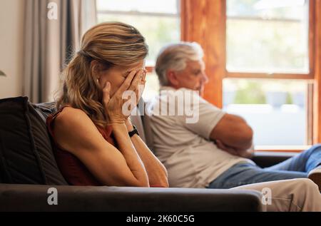Crying, divorce and fight with a senior woman sad in her home after an argument with her husband. Depression, stress and couple with a wife angry Stock Photo