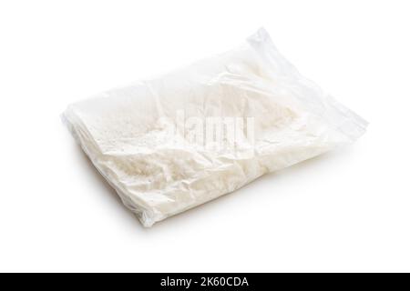 Uncooked rice in the cooking sack isolated on white background. Stock Photo