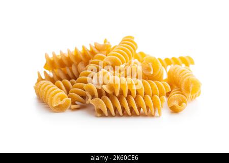 Uncooked whole grain pasta isolated on the white background. Stock Photo