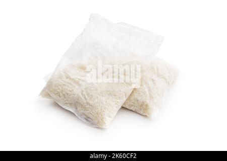 Uncooked rice in the cooking sack isolated on white background. Stock Photo