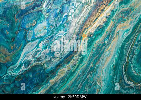 Abstract fluid art background. Turquoise, golden and white ocean, marble effect texture. Close-up of an acrylic painting on canvas. Stock Photo
