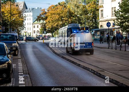 Krakow, Poland - October 08, 2022 Police car driving in the city center of Krakow in Poland Stock Photo