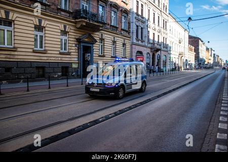 Krakow, Poland - October 08, 2022 Police car driving in the city center of Krakow in Poland Stock Photo