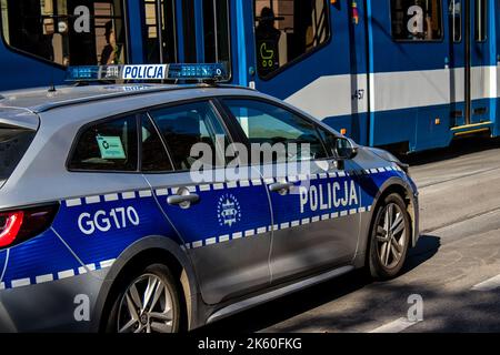 Krakow, Poland - October 08, 2022 Police car driving in the city center of Krakow in Poland Stock Photo