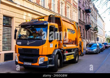 Krakow, Poland - October 08, 2022 Garbage truck driving in the city center of Krakow in Poland Stock Photo