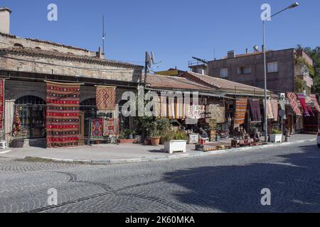 Traditional handmade carpets,   rugs hanging in front of the carpet shops in street Stock Photo