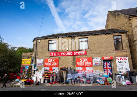 Families and women and old people use the Pound store and a discount store to shop in the town of Wyke situated within the City of Bradford boundaries. As the cost of living crisis bites and hits people on lower incomes more are turning to discount shops to save money.Credit: Windmill Images/Alamy Live News Stock Photo