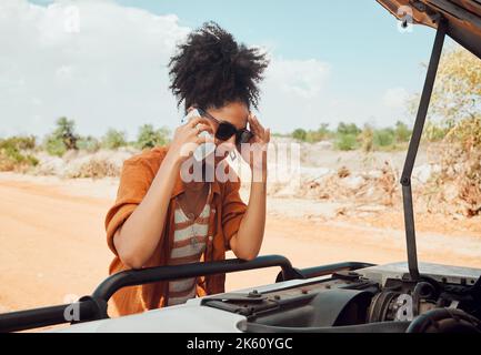 Worried woman, phone call and engine problems speaking to engineer or mechanic on a desert road in nature. Stressed black female calling roadside