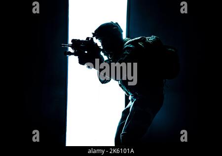 Paratroopers of french 1st Marine Infantry Parachute Regiment RPIMA studio shot firing pointing weapons Stock Photo