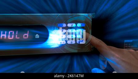 Finger pressing password code on safe box to open metal safe in hotel. Cyber security and data protection concept. Business technology privacy Stock Photo