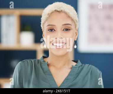 Happy, smile and young black business woman, entrepreneur and employee in modern office of New York. Portrait face of creative startup manager working Stock Photo