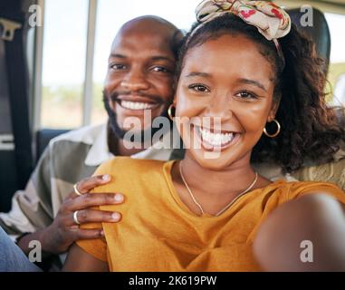 Selfie, road trip and couple with a black woman and man on a car during a holiday or vacation together. Happy, relax and love with a young male and Stock Photo