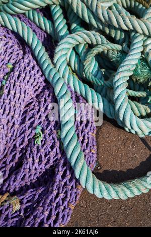 Colorful Rope Nets Messy background of colorful old fishing nets and ropes under sunlight ...