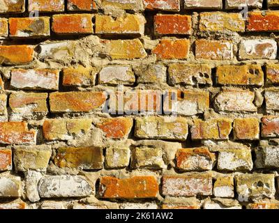 Texture of old weather-damaged brick wall as background Stock Photo
