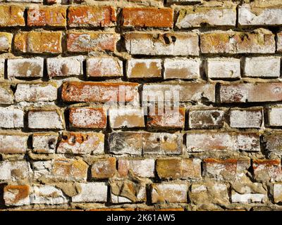 Texture of old brick wall destroyed by weather and time Stock Photo