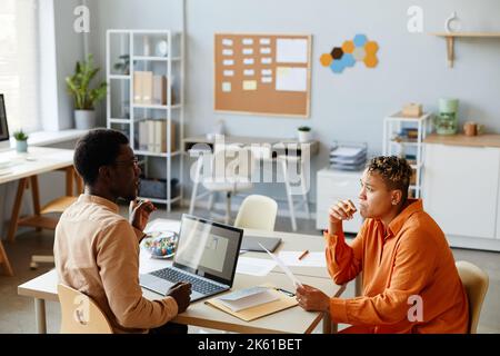 Side view portrait of two black business people working together during meeting in IT development office Stock Photo