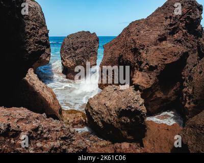 Puerto rico Aguadilla survival beach caves with big rocks formation from the caribbean coast puerto rico northwest side. Island coast nature structure Stock Photo