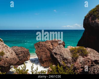 Puerto rico Aguadilla survival beach caves with big rocks formation from the caribbean coast puerto rico northwest side. Island coast nature structure Stock Photo