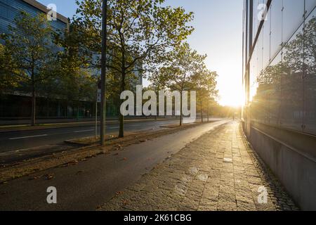 Copenhagen, Denmark. October 2022. the sun rising in the morning on a deserted street in the city center Stock Photo