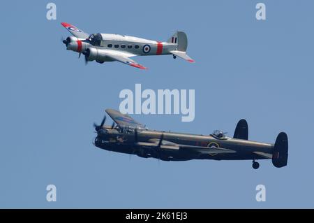 Avro Lancaster PA474 and Avro C19 G-AHKX, in formation at Old Warden, Biggleswade, Bedfordshire, England, United Kingdom, Stock Photo
