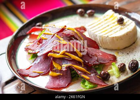 Montenegrin traditional cured meat and cheese dish close up, selective focus Stock Photo