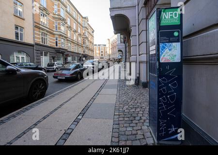 Copenhagen, Denmark. October 2022.  the column of a parking meter on a street in the city center Stock Photo