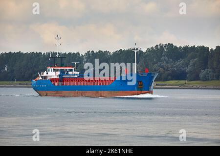 Ship carrying cargo on a river Stock Photo