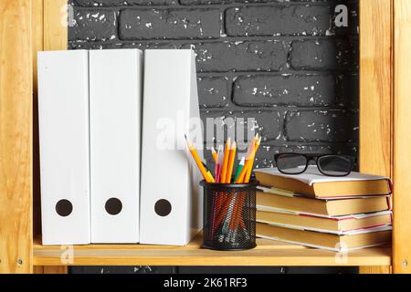 File folders, standing on the shelves at office Stock Photo