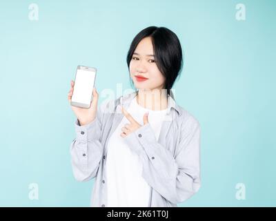 mobile shopping happy asian woman online payments Stock Photo