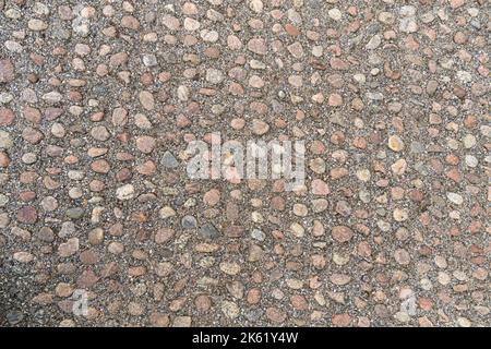 Old pavement of granite background. Top view on stone road close up. Stock Photo