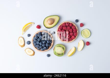 Fresh fruits and vegetables on grey background. Healthy eating concept. Flat lay, composition. Stock Photo