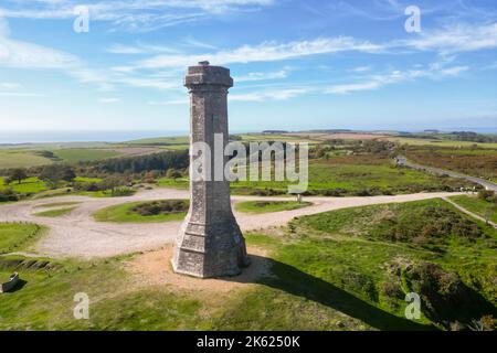 Portesham, Dorset, UK.  11th October 2022.  UK Weather.  View from the air of Hardy Monument on Black Down near Portesham in Dorset on a warm clear sunny autumn afternoon.  The monument is 72 foot high and was erected in 1844 by public subscription in memory of Vice Admiral Sir Thomas Masterman Hardy, flag captain of Admiral Lord Nelson at the Battle of Trafalgar. Picture Credit: Graham Hunt/Alamy Live News Stock Photo