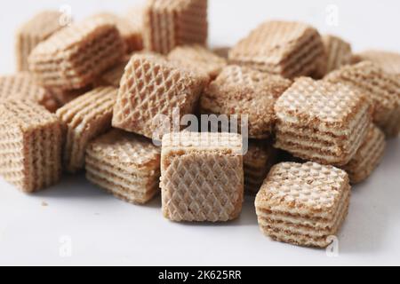 brown chocolate wafer roll on white  Stock Photo