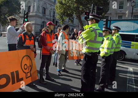 London, UK, 11 Oct 2022 Just Stop Oil  block traffic in Whitehall outside Downing Street. Credit: JOHNNY ARMSTEAD/Alamy Live News Stock Photo