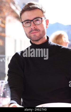 Elegant man wearing turtle neck sweater and classic eyeglasses Stock Photo