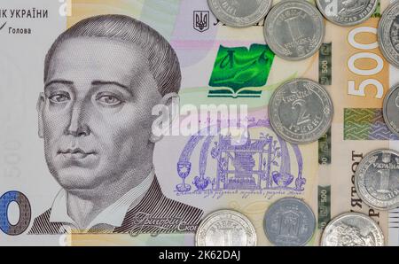 five hundred ukrainian hryvna banknote and coins closeup with portrait of Hryhorii Skovoroda (1722-1794), writer and composer Stock Photo