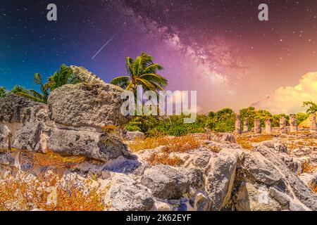 Iguana lizard in ancient ruins of Maya in El Rey Archaeological Zone near Cancun, Yukatan, Mexico with Milky Way Galaxy stars night sky. Stock Photo