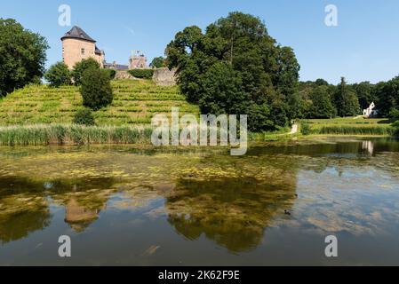 Lennik, Flemish Brabant Region, Belgium - 07 20 2021 - The Gaasbeek medieval castle reflecting in a water pond Stock Photo
