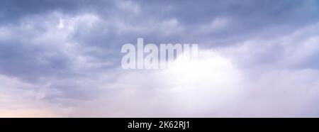 Dramatic sky background. Stormy clouds in dark sky. Moody cloudscape Stock Photo