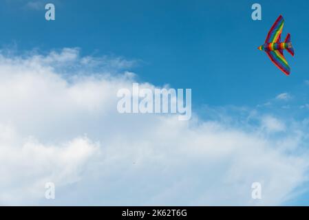colorful kite flying in the wind , Freedom and summer holiday concept Stock Photo