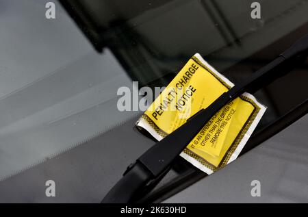 Parking ticket, penalty charge notice, on car windscreen, UK Stock Photo