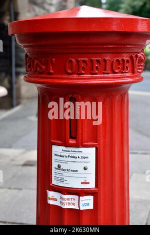 Early Victorian VR red pillar box, post box, cast in shape of Doric column, note the small opening for letters, Warwick, UK Stock Photo